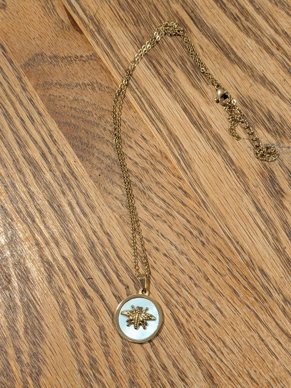 Gold Bee Pendant Necklace with White Enamel Accent